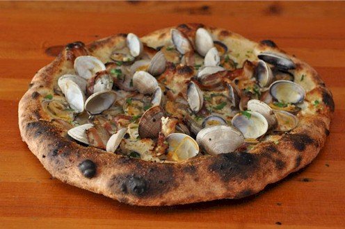 pizza with clams in shells arranged on top